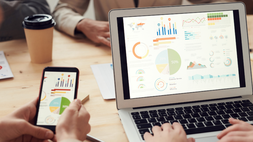 Analytics dashboards displayed on a laptop and phone